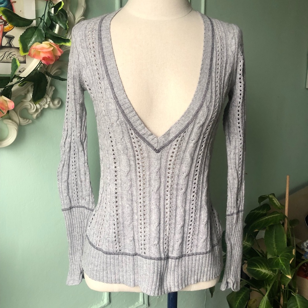 V neck gray sweater.